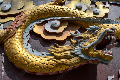 Dakshinkali, Nepal: details of a golden snake, part of the ornaments of the statue of Guru Rinpoche (Padmasambhava, Born from a Lotus), tantric Buddhist Vajra master, built in 2012 on a hilltop photo
