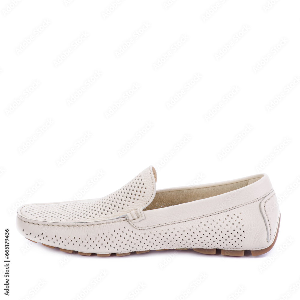 Modern ivory perforated leather men's moccasin shoe isolated on a white background with copy space. Creative minimalistic layout with footwear. Shoe store advertisement. Modern ivory perforated leather men's moccasin shoe isolated on a white background with copy space. Creative minimalistic layout with footwear. Shoe store advertisement.