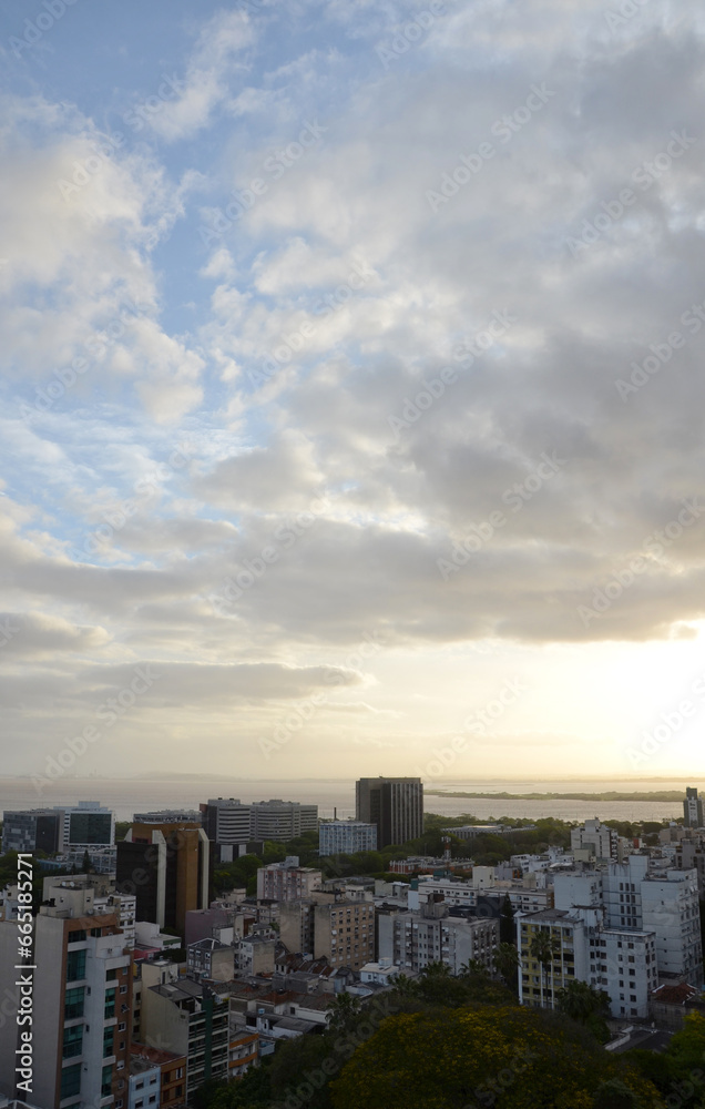 Aerial view of the central area of Porto Alegre with the Guaiba River in the background - sunset with clouds