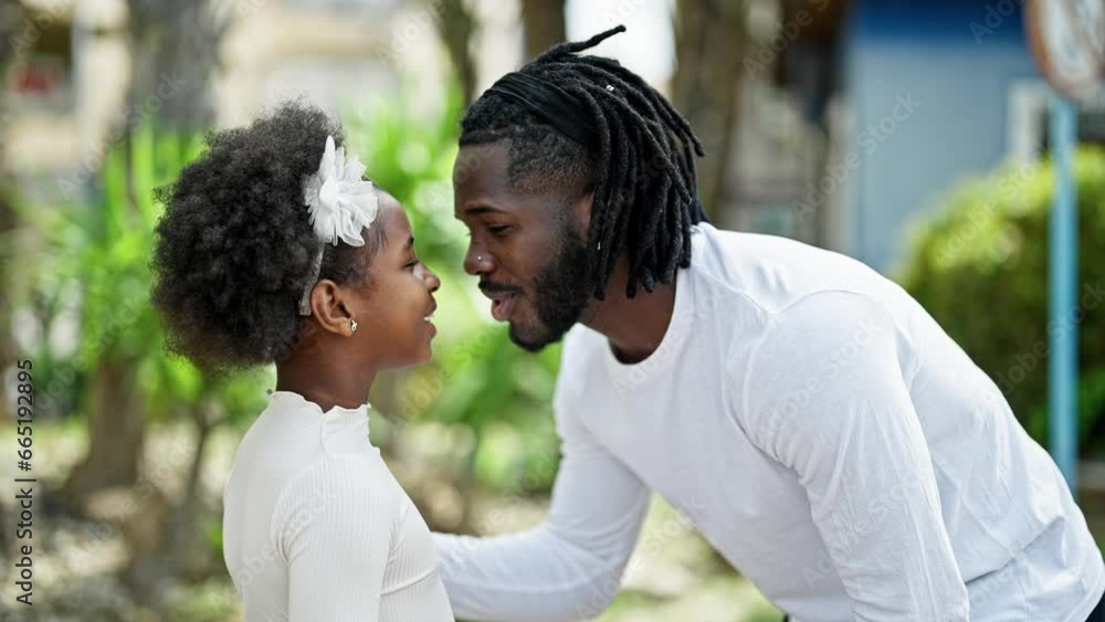 African american father and daughter smiling confident standing together at park African american father and daughter smiling confident standing together at park