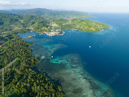 Lush rainforest surrounds the town of Waisai in Raja Ampat. This is the capital of the Raja Ampat regency in eastern Indonesia.