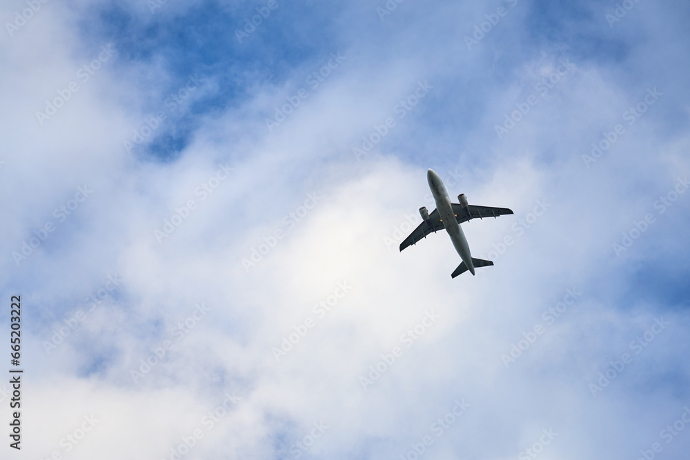 Vantaa, Finland - October 08, 2023: Airplane landing at the Helsinki Vantaa International airport with clouds on the background. Vantaa, Finland - October 08, 2023: Airplane landing at the Helsinki Vantaa International airport with clouds on the background.