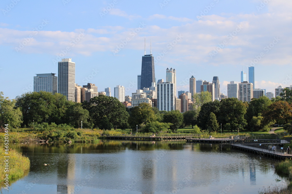 Chicago, Illinois, USA; 4 October 2023: View of the city of Chicago from the Lincoln Park Zoo nature boardwalk. IN front of the lake. Chicago, Illinois, USA; 4 October 2023: View of the city of Chicago from the Lincoln Park Zoo nature boardwalk. IN front of the lake.