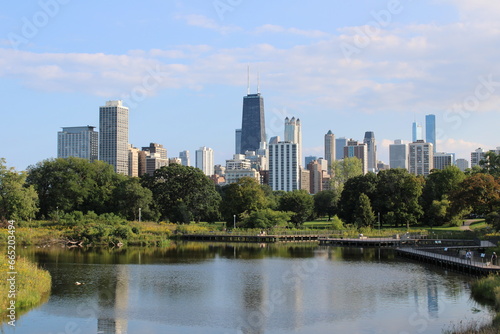Chicago, Illinois, USA; 4 October 2023: View of the city of Chicago from the Lincoln Park Zoo nature boardwalk. IN front of the lake. photo
