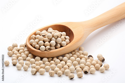 Close-up image of wooden spoon filled with white pepper seeds. This picture can be used to showcase texture and details of white pepper seeds, as well as in cooking and food-related designs.