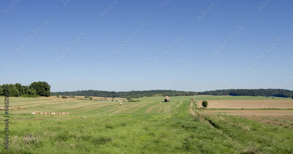 Agricultural work on a summer day, tractor, harvesting hay bales, part 7 Agricultural work on a summer day, tractor, harvesting hay bales, part 7