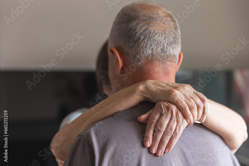 Senoir couple hugging and dancing together photo