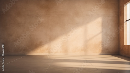 Interior of a earthy pastel painted empty room, with soft warm light coming in from a window, abstract background with room for copy. 