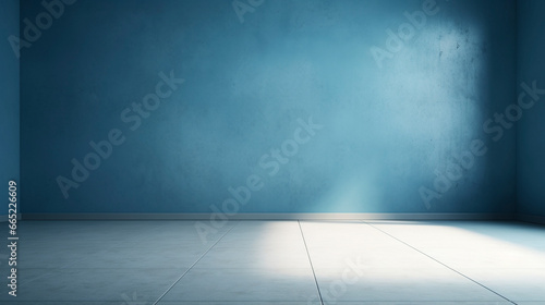 Interior of a blue pastel painted empty room  with soft warm light coming in from a window  abstract background with room for copy. 