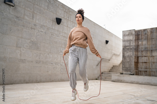 one woman young adult caucasian female with jumping rope training