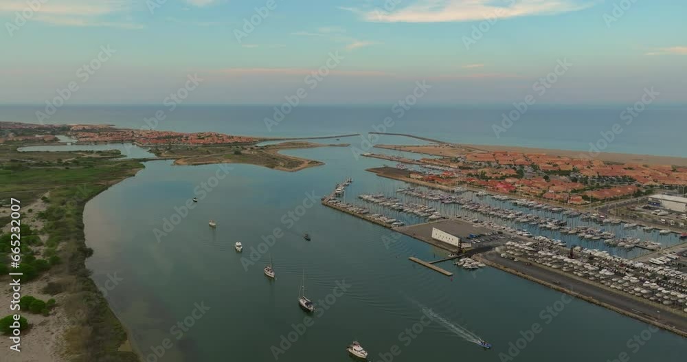 Aerial view of port Leucate with mediterranean sea in background, sunset france aude occitanie Aerial view of port Leucate with mediterranean sea in background, sunset france aude occitanie