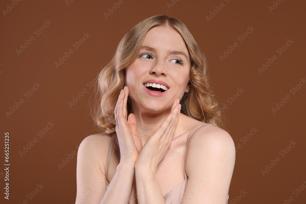 Portrait of beautiful woman with blonde hair on brown background Portrait of beautiful woman with blonde hair on brown background