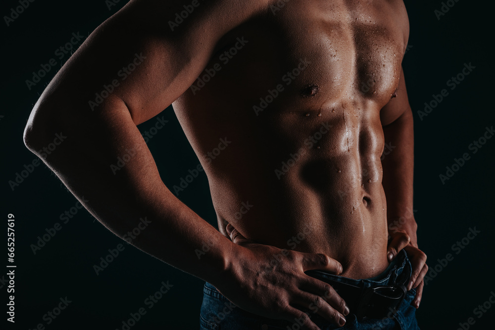Partial image of sweaty male's torso. Fit sweaty chest. Man showing perfect six pack abs. Partial image of sweaty male's torso. Fit sweaty chest. Man showing perfect six pack abs.