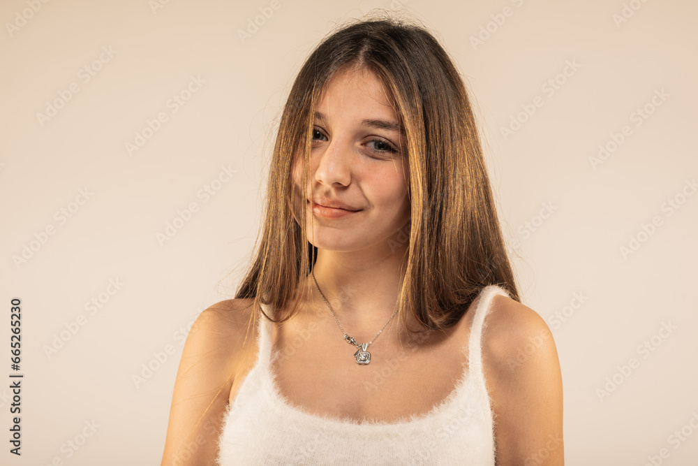 Young beautiful smiley girl in white wooly top isolated Young beautiful smiley girl in white wooly top isolated