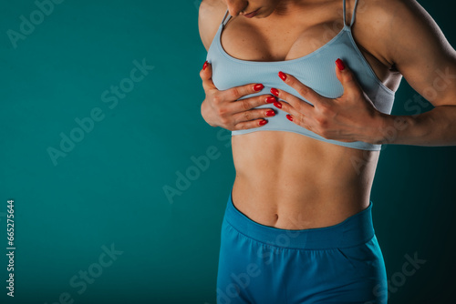 Confident Fit Girl Exercising for Body Transformation Goals in Studio