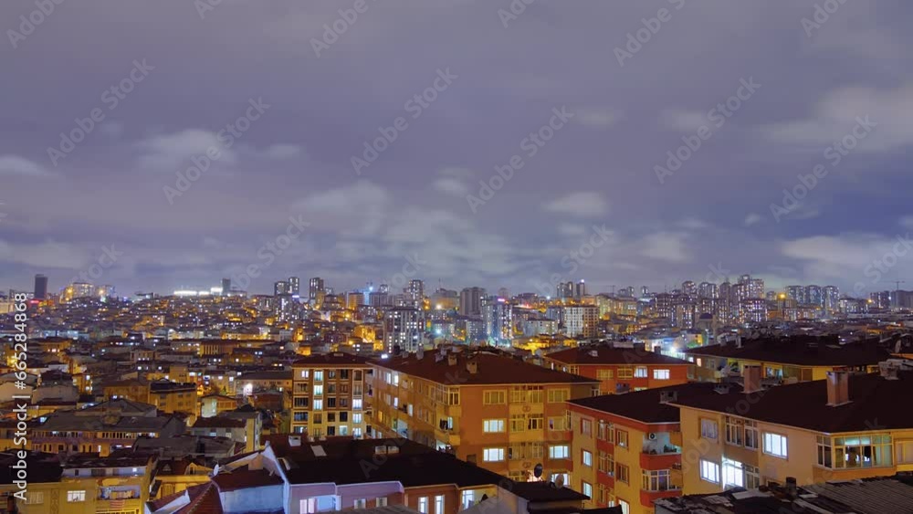 Timelapse: fast moving clouds in the dark sky over typical turkish residential buildings with blinking windows and warm lighting in Istanbul, Turkey at night. Architecture and time lapse concept Timelapse: fast moving clouds in the dark sky over typical turkish residential buildings with blinking windows and warm lighting in Istanbul, Turkey at night. Architecture and time lapse concept