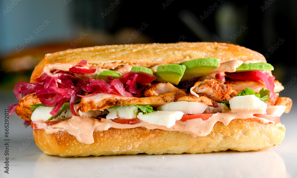 Roasted chicken sandwich with spicy aoli and pickles onions Roasted chicken sandwich with spicy aoli and pickles onions