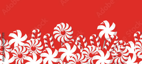 The border is a sweet Christmas candy. Lollipop on a stick. Festive sweetness. Caramel candies. Sweet New Year's dessert.	