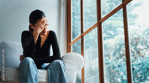 Photos Depressed young Asian woman with mental health problem in mind need uttermost treatment from overthinking fatigue, disruptive thought, dissocial, anxiety and other mental health disorders