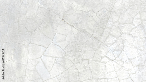 Image of cracked cement floors inside a building.