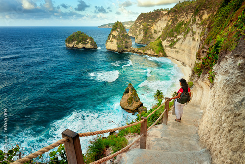 Travel people enjoy epic view nature landscape tropical beach Bali with scenery mountain rocks in ocean on nature background Bali Indonesia