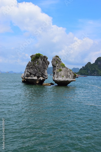 HA LONG BAY, VIETNAM - JULY 19, 2022: Beautiful view of the Halong bay, Vietnam. UNESCO World Heritage. This was on a cloudy day, with many boats and spells of sunshine. during the Covid 19 pandemic. 