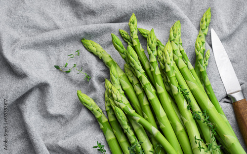 Fresh green asparagus on  textile background.
