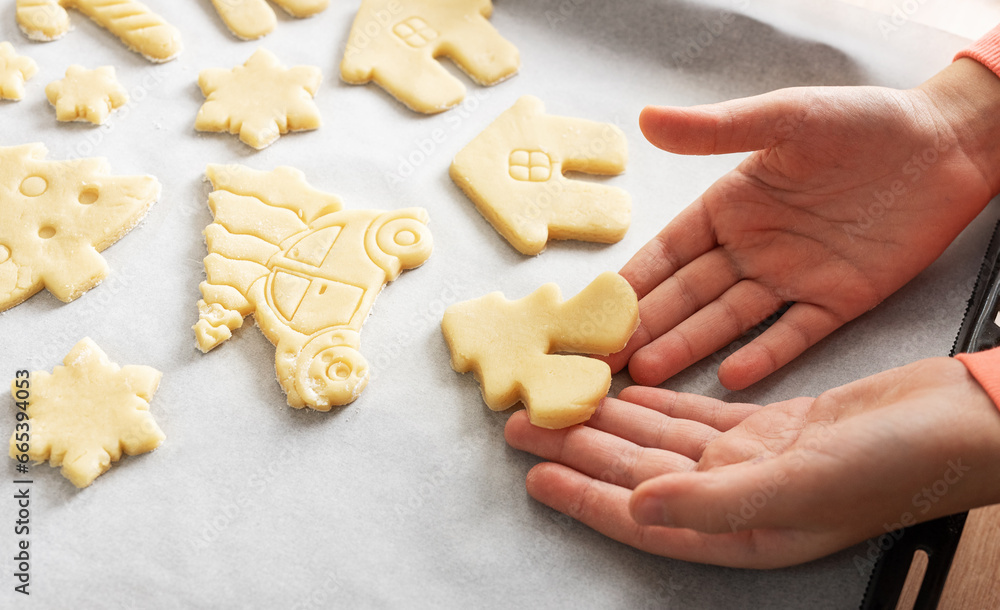 Children's hands with gingerbread cookies on wooden background Children's hands with gingerbread cookies on wooden background