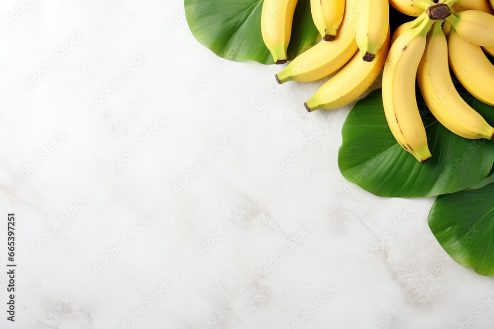 Photo of bunches of bananas lying on the leaves of a banana tree. Tropical background. White minimalistic background. Texture of light marble. Fresh, appetizing, tasty and healthy fruit. - obrazy, fototapety, plakaty 