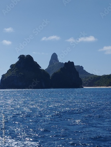 Postcards of Fernando de Noronha seen from the sea. Morro do Pico and Morro Dois Irm  os