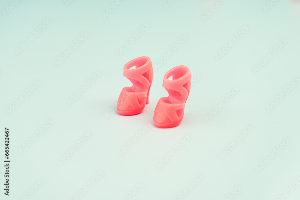 Toy doll shoes on pink background, Toy doll shoes on pink background,