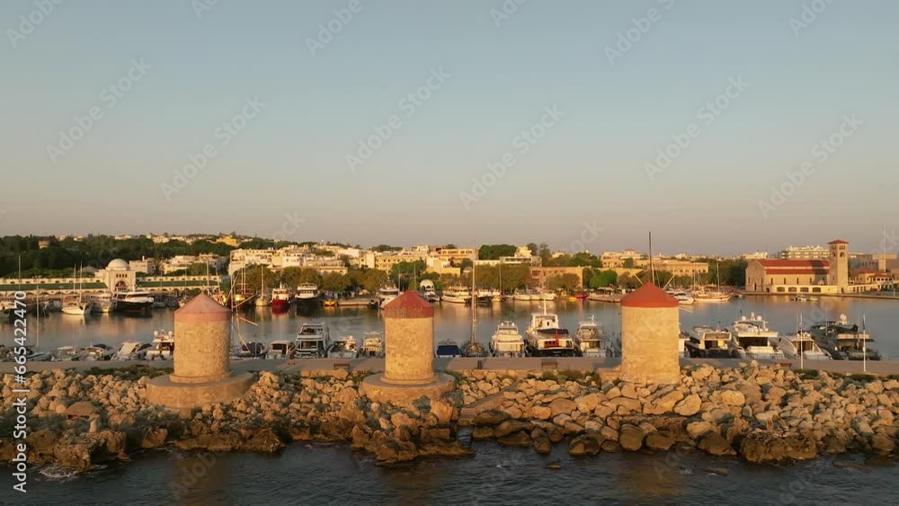 Rhodes marina and old city houses and fortifications, Aerial view Rhodes marina and old city houses and fortifications, Aerial view