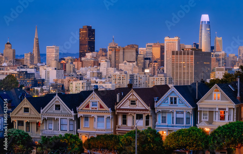 Evening, Painted Ladies Victorian houses in Alamo Square and a view of the San Francisco skyline and skyscrapers. Photo processed in pastel colors