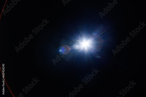 Easy to add lens flare effects for overlay designs or screen blending mode to make high-quality images. Abstract sun burst  digital flare  iridescent glare over black background.