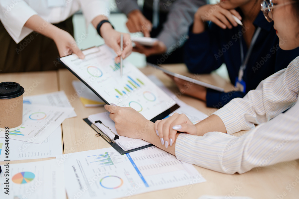 © Jirapong - Asian business advisor meeting to analyze and discuss the situation on the financial report in the meeting room.Investment Consultant, Financial , teamwork ,brainstorming ,startup and accounting