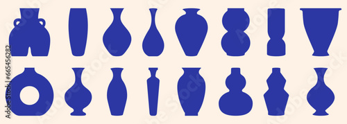 Set of vases with different shapes and forms. Dark blue colored geometric pottery