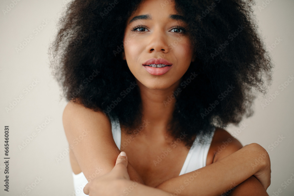 Portrait of Beautiful Young Woman Posing In Studio Over Beige Background. Portrait of Beautiful Young Woman Posing In Studio Over Beige Background.