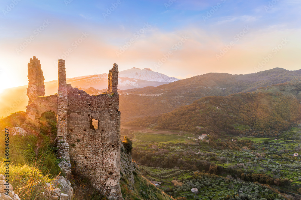 beautiful sunset or sunrise landscape of ancient ruins on a top of a hill with green mountains with white snow top on background beautiful sunset or sunrise landscape of ancient ruins on a top of a hill with green mountains with white snow top on background