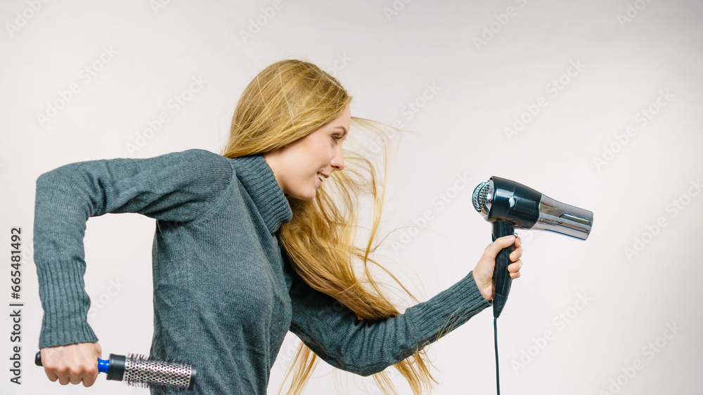 Girl holds hair accessories, styling hair Girl holds hair accessories, styling hair