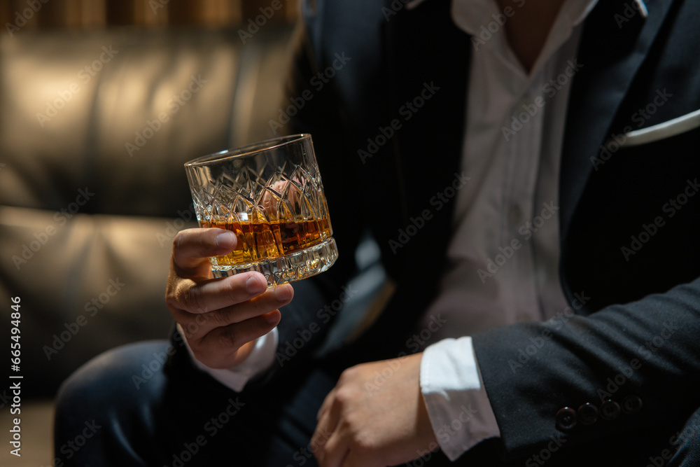 Businessman wearing a suit whiskey glass of liquor. Businessman wearing a suit whiskey glass of liquor.