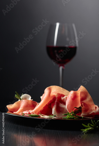 Prosciutto with rosemary and red wine.