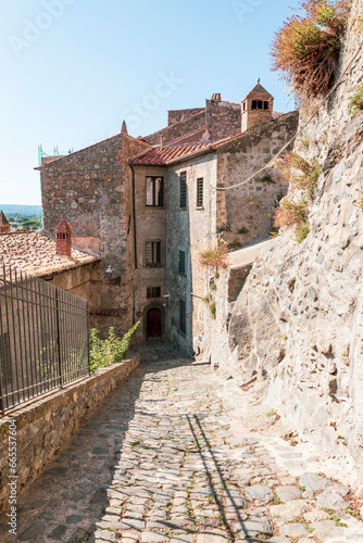 a cobbled street with traditional old houses in Bolsena, province of Viterbo, Lazio, Italy