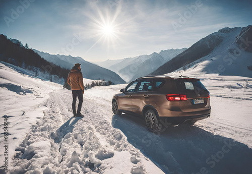 man traveling exploring, enjoying the view of the mountains, landscape, lifestyle concept winter vacation outdoors. man standing near the car in sunny day, travel in the mountains, freedom