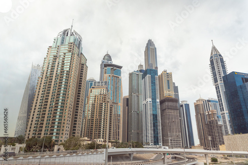 View from the window of a tourist bus on the architecture of the Dubai city, United Arab Emirates