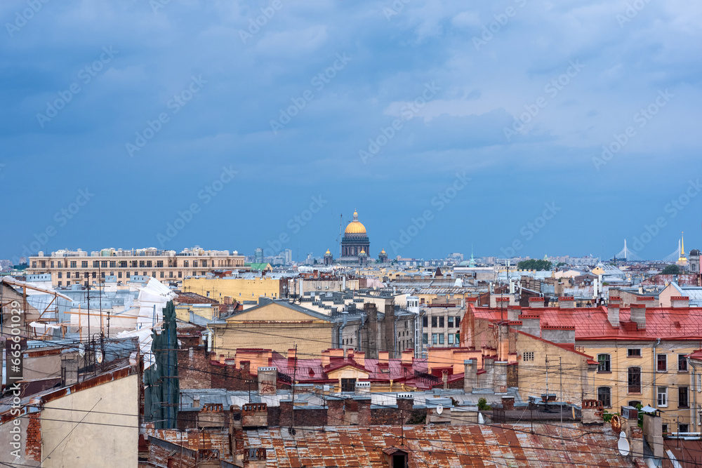 top view of the city roofs in the historical center of Saint Petersburg with rainy sky