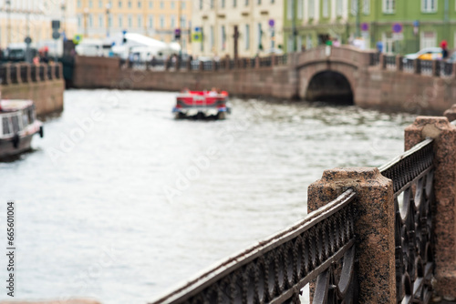 blurred landscape of the city embankment, canal fencing in the historical center of the city