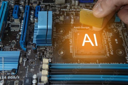 Close up of a hand holding an Ai chip on a electronic circuit board, artificial intelligence concept and new technologies