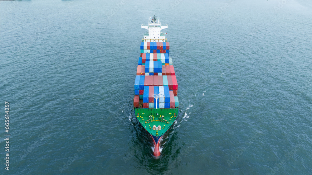 Aerial front view of cargo container ship carrying container box running for export concept technology logistics freight shipping and service transportation