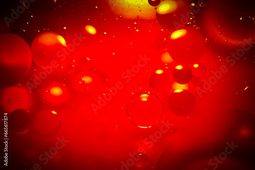 Red oil floating on the surface of the water.