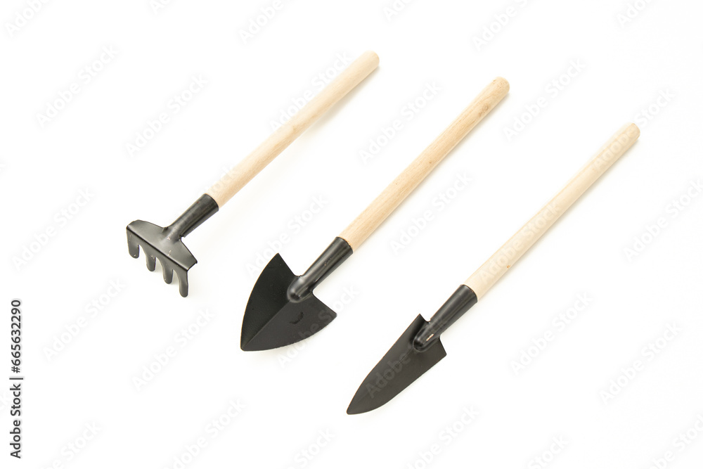 shovels, hoes, sieves, gardening equipment on white background.